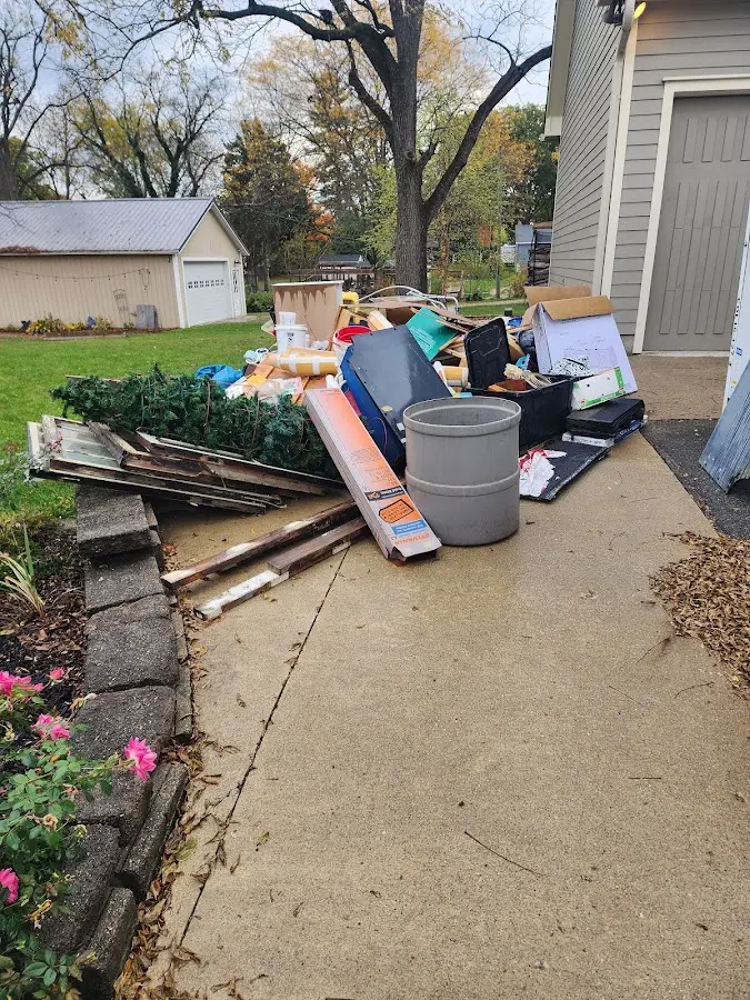 Dumpster being loaded with debris for Residential Dumpster Rental in Superior